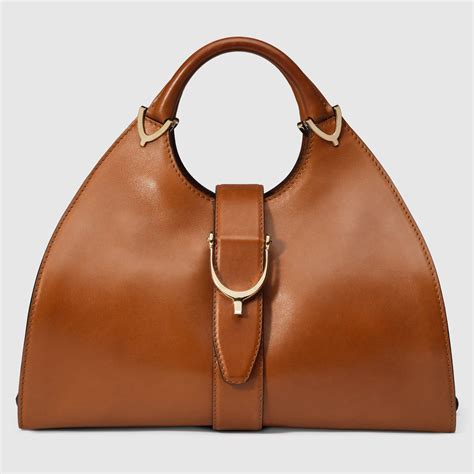 gucci stirrup leather top handle bag|Gucci handbags for sale.